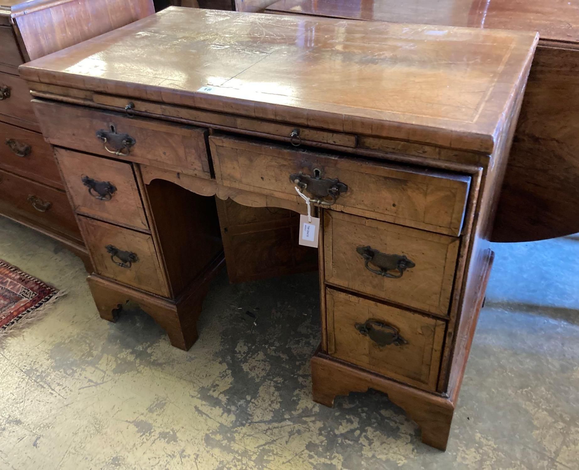 A walnut kneehole dressing table/desk, incorporating antique timbers, width 95cm height 75cm